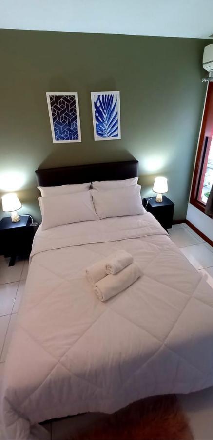 Bliss Hoteis Centro Armacao dos Buzios Luaran gambar A bed with a duvet